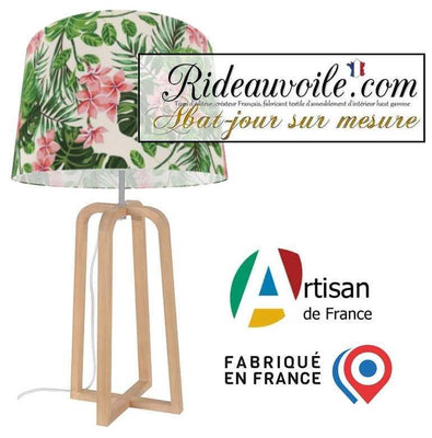 Tissu d'ameublement imprimé par motif répétitif dans un style Exotique Tropical avec de larges feuilles vertes et des fleurs colorées.